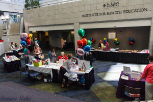 Vendors set up tables in atrium. 