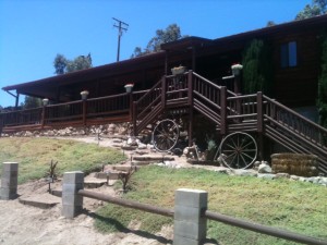 Log cabin at the "Paws for Effect" ranch.